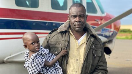 Boniface and Ojiya prepare to travel with MAF