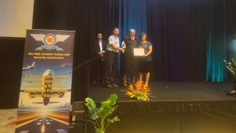 Hon. MP Mr Schnaubelt presenting the long service award to MAF's Brad Venter and Sonali Ghosh