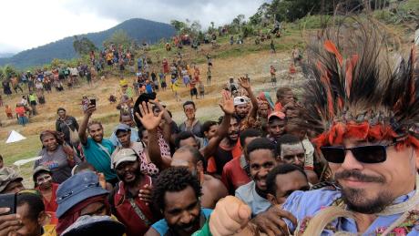 Captn Ryan Cole carried on the shoulders of the people after he landed the first MAF aircraft at Dimanbil