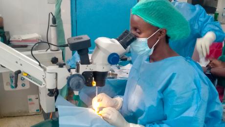 Ophthalmologists performing sight restoring surgeries during the clinic