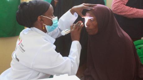 Eye doctor examining patient