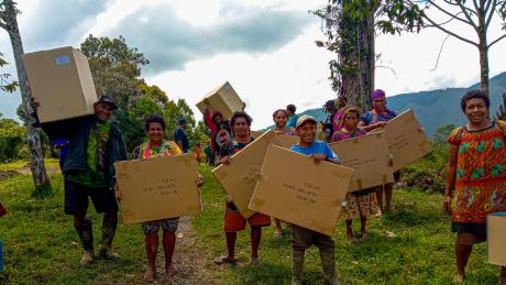 Locals from from Tolax community recieving their solar home kits