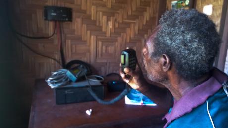 Bilson Maina, doing a test radio call to Kompiam Hospital via the High Frequency radio.