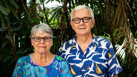 Retiree couple facing camera