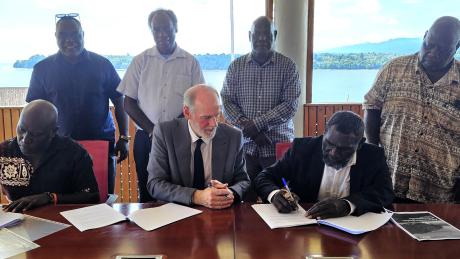 The Honourable President Ishmael Toroama is signing the MOU