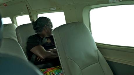 Yolngu woman sitting in plane