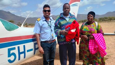 Pilot Roshan with the patient and his wife