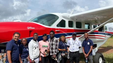 Trinity Dental Clinic team outside an MAF plane