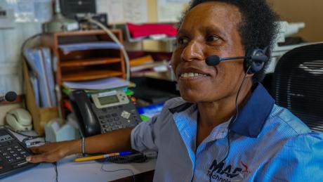 A woman using a radio headset