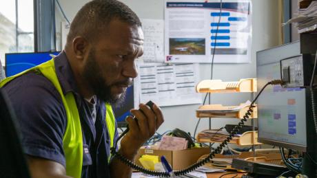 A man talks on a radio