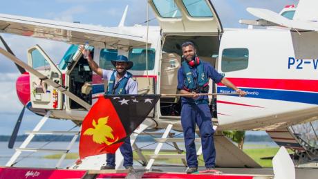 Joseph Tua and Titus Oaeke celebrate Independence on the float plane floats