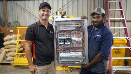 Electricians work on upgrading the generator