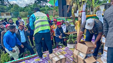 Pastors and youth from CAF Church distributing Bibles among participants during the National Youth Conference.