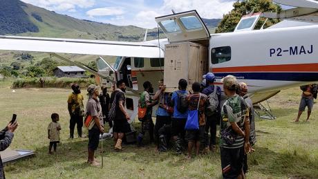 Offloading the vaccine fridge and solar panels