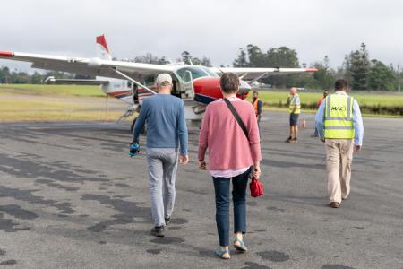 Hanno Allolio and Jutta Werdes walk to MAF plane.