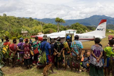 View down the Pyarulama airstrip with the crowd of people watching