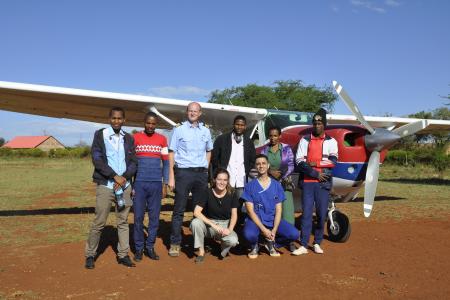 From left: Basil Ombay, John Danieli, MAF Pilot Peter Griffin, Jacob Peter, Rehema Matfari, Kyrillos, Tumaini and Janneke Kampherbeek at the Haydom Airstrip in Tanzania