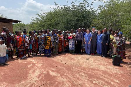 Mothers pose with the medical and evangelist during a mobile clinic at Dabia.