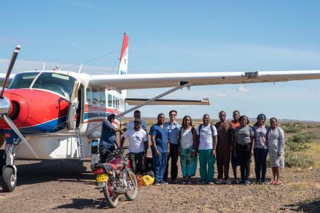 From left to right: Amon Tole, Bernard Osinde,Seth Simiyu, Dr. Philemon Nyambati, Capt. Daniel Gill, Joy Mwikali, Amos Situma, Dr Brian Maluki, Jacob Galgithe (local guide), Grace Ochieng, Brenda Cheruyiot and Pst Emmy Chebiwot at Kargi airstrip.