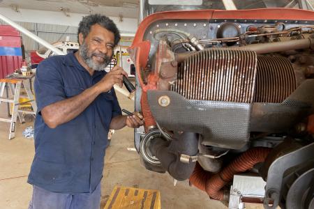David Lamboa standing next to aircraft