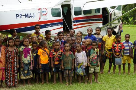 The Children in front of the MAF plane