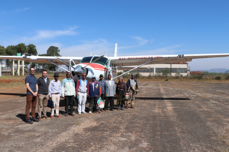 Translation team on Antsirabe Airstrip in front of MAF plane