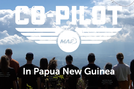 The Co-pilot team is standing at the top of Rondon Ridge looking over Mount Hagen