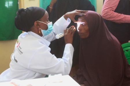 Eye doctor examining patient