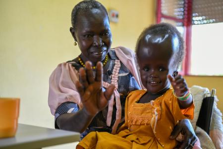 Four-year-old Raya Rose and her grandmother Estherina are being helped by OVCI 