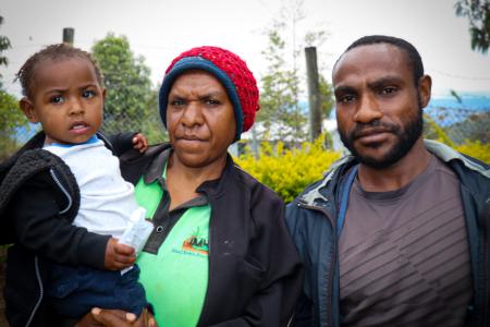 Baby Inan and her smiling parents at the Nomane Health Center.