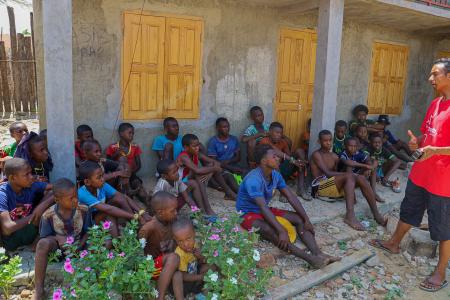 Hasina sharing the Gospel to a group of young people
