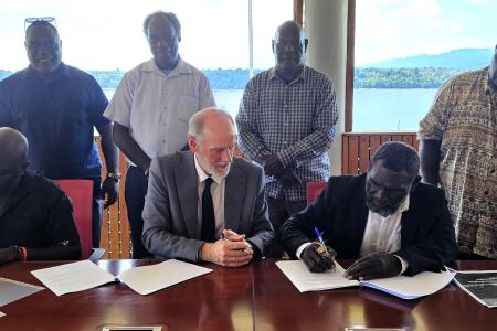 The Honourable President Ishmael Toroama is signing the MOU