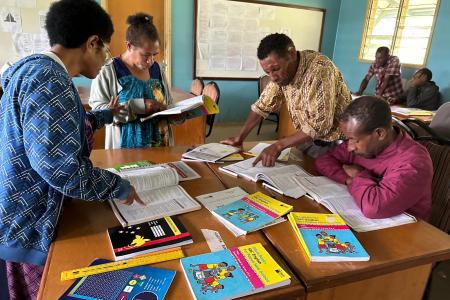 Bilum Books training course with teachers sitting around tables and working in groups