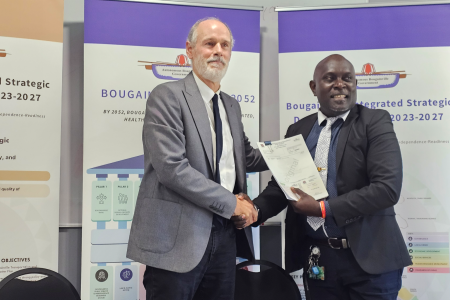 John Woodberry and Chief Secretary Mr. Nanei shaking hands