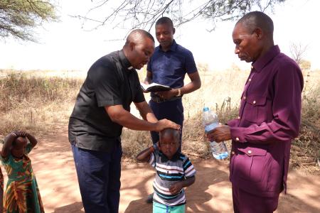 Eric Dadi being baptized