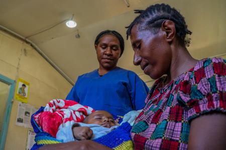 Ailin Efako and her Baby 1 are being attended to by Nursing Officer Mulda Monopi at Sigerehe Health Centre.