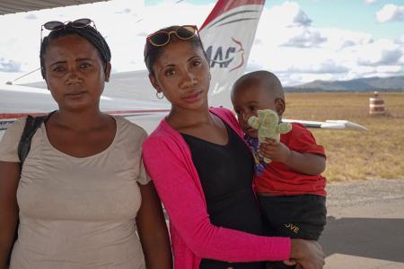 Lovasoa with his mom and his aunt holding him