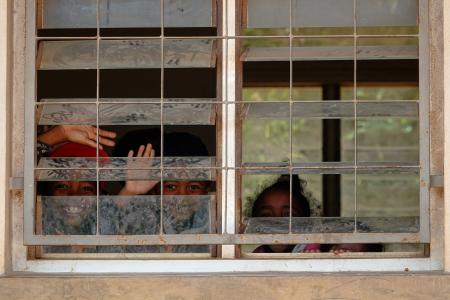 Kids looking Through the Window