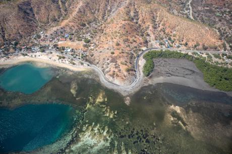 An aerial view of a beach and reef