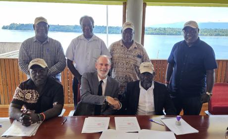 shaking hands after signing the MOU