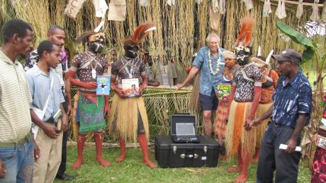 2011 Dan Shaw with traditionally dressed Samo people celebrating the donation of education materials 