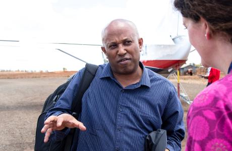 MAF communications manager interviewing passenger