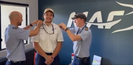 Erwin Jungen getting his 'wings' (epaulettes) put on by his flight instructors