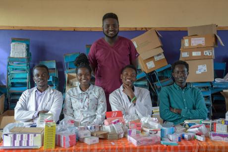 Dr. Samuel alongside medical personnel at the medical camp.