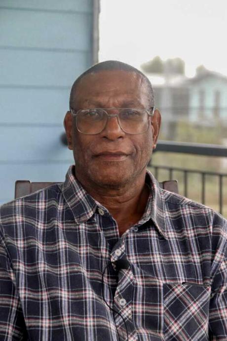 Medium shot image of Pastor Daki Wakili as he poses for a picture.