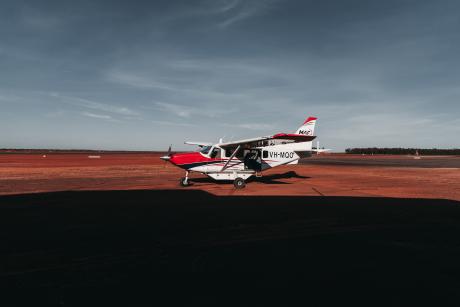 An MAF plane against a dark grey sky