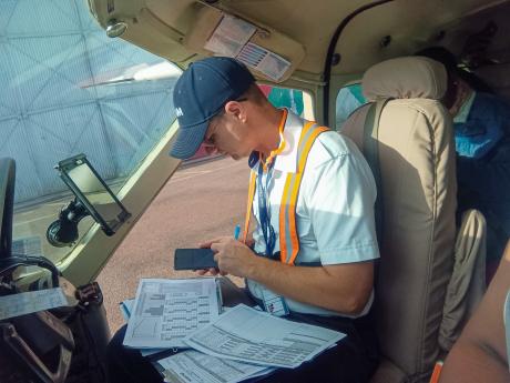 Pilot Daniel preparing for take-off at Wilson Airport.