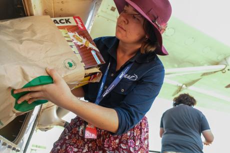 Loading an aeroplane woth groceires