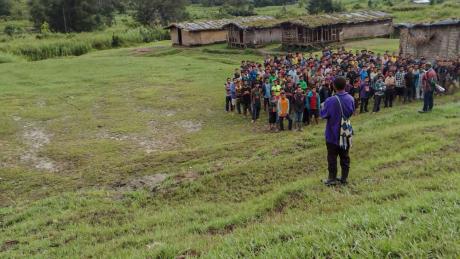 School students lined up for assembly with teacher
