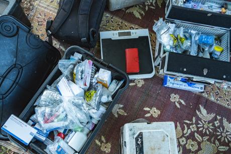 Medical supplies on mat on ground